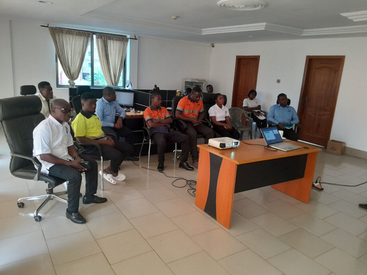 Group seated around a boardroom table during a working session