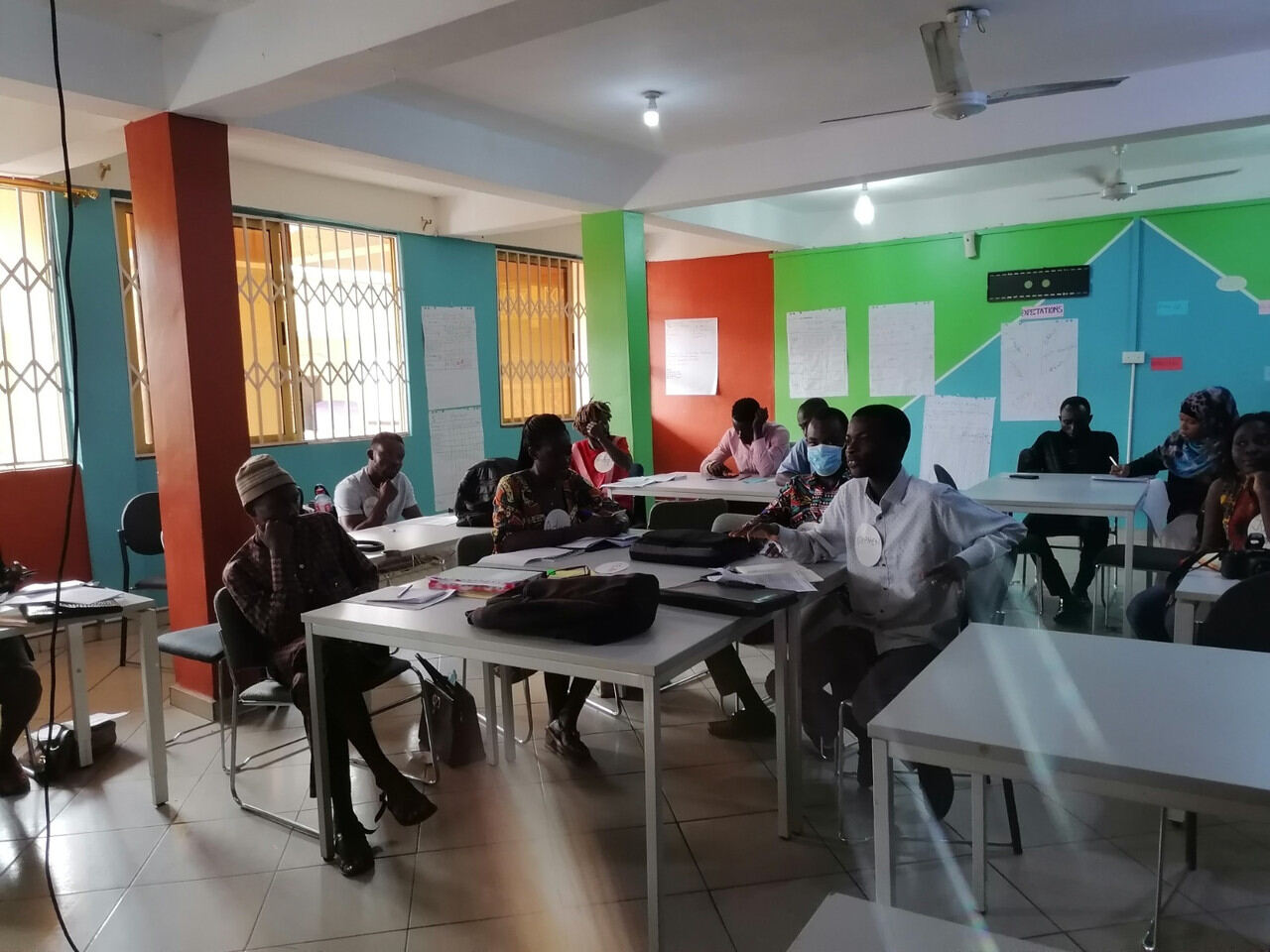 Participants at tables in a business training room