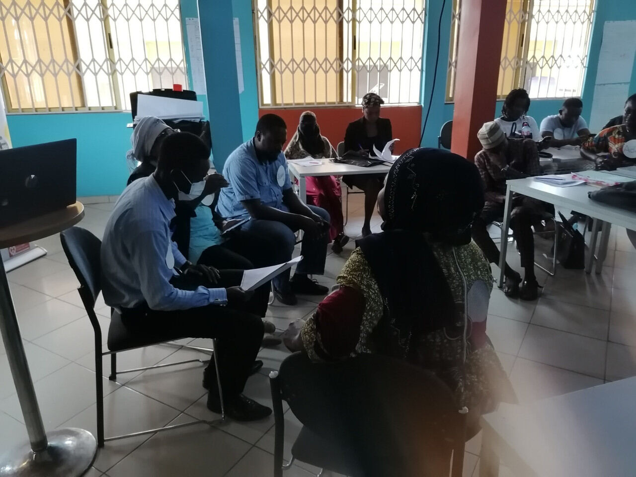 Participants engaging with a facilitator in a classroom setting