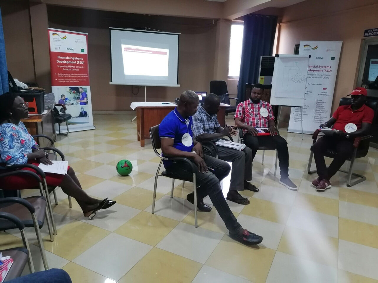 Presenter speaking while participants take part in discussion