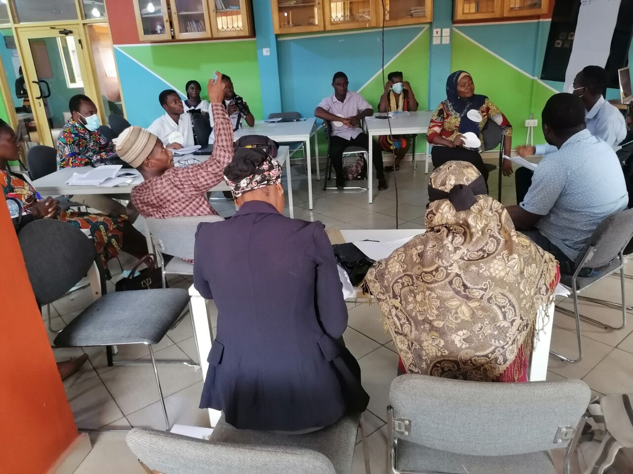 Stakeholders seated around a table during a roundtable discussion