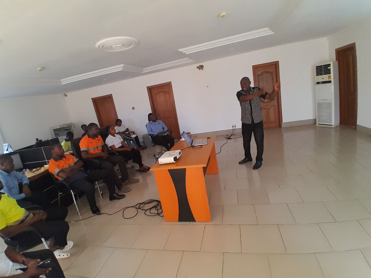 Facilitator presenting to seated participants during a training session